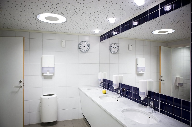 Bathroom with multiple Tork hygiene dispensers for soap and paper towels by Bay West Caribbean