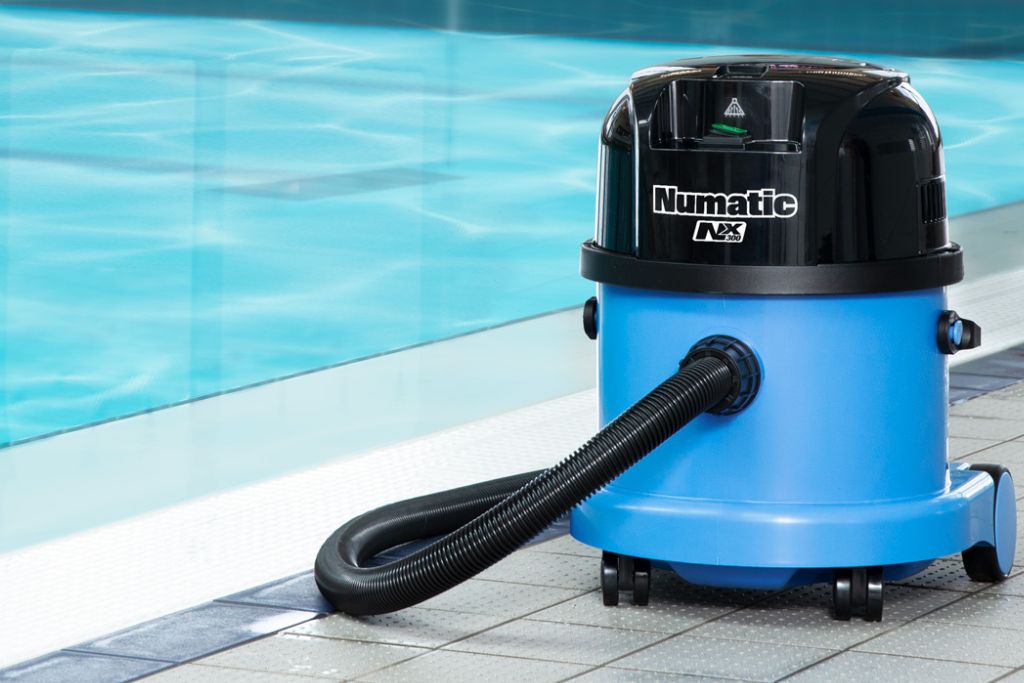 Numatic vacuum cleaner by a swimming pool